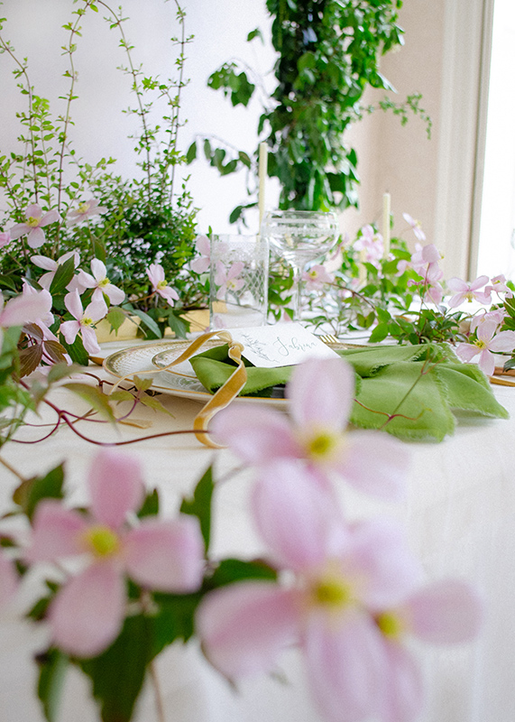 Details of wedding table filled with flowers designed by Andreea Bucur of Teastyle